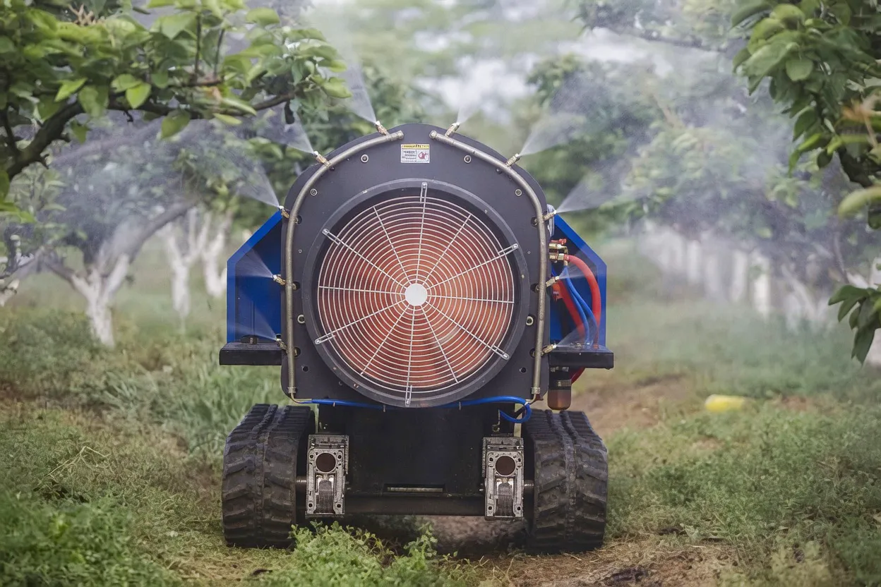 Air-blast orchard sprayer in operation Kent UK fruit farm